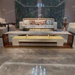 Architectural TV Stand with Sculpted Relief Panels Natural Wood Veneer Open Display Shelves and Soft Ambient Lighting
